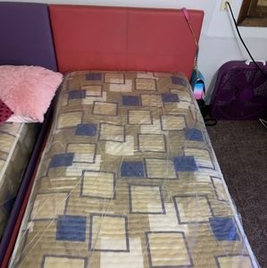 Two girl twin size beds one pink one purple